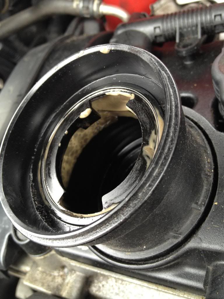 Why does my oil cap and inlet tube look like this? whats going on VW